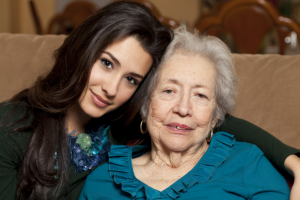 Caregiver and elder smiling